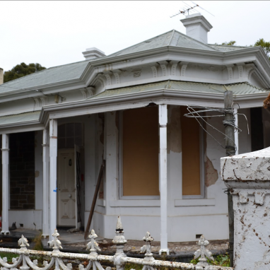 Decaying external shot of home ready to be renovated