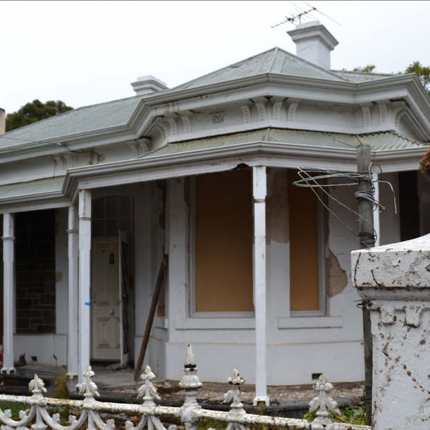 Decaying external shot of home ready to be renovated